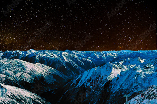 night view of snowy mountain range and milky way. starry night sky with stars and moon. beautiful landscape with snowy mountain peaks in winter night.