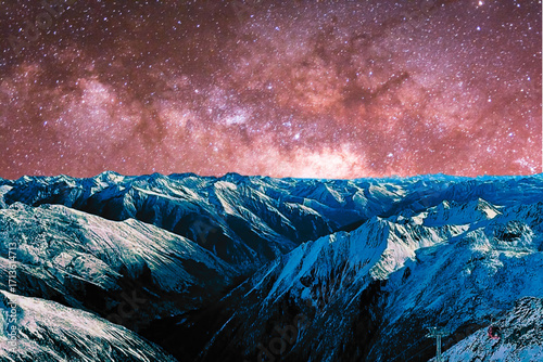 night view of snowy mountain range and milky way. starry night sky with stars and moon. beautiful landscape with snowy mountain peaks in winter night.