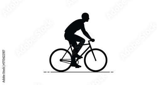 Silhouette of a cyclist riding a bicycle on a flat surface