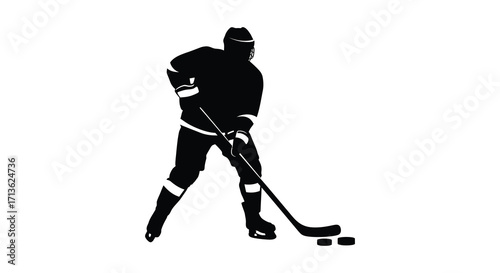 Silhouette of a hockey player with stick and puck on ice