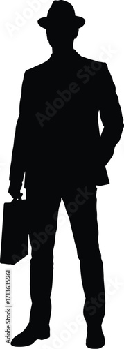 Man in suit holding briefcase standing