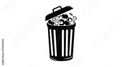 An open trash can overflowing with discarded chicken bones and waste