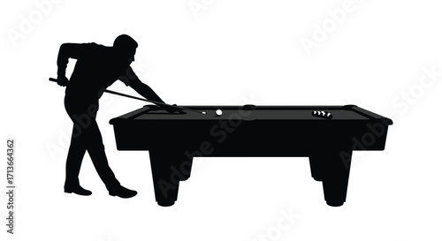 Silhouette of a man preparing to shoot a pool ball on a table