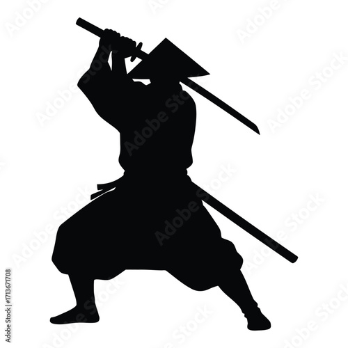 Silhouetted samurai warrior in action pose holding two swords