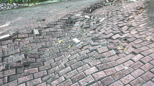 Broken and Uneven Brick Pavement with Exposed Foundation