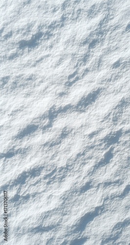 Close-up view of textured, light gray snow