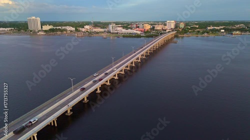 Wallpaper Mural Traffic on Caloosahatchee Bridge over river at dusk, Fort Myers cityscape in background, Florida. USA. Aerial drone view Torontodigital.ca