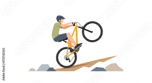 Man performs a wheelie on a yellow mountain bike on a dirt path, wearing a helmet.
