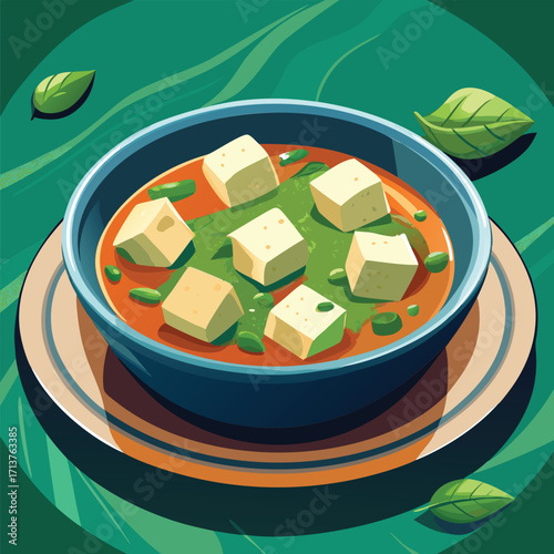 A bowl of paneer dish with cubes of paneer in a spicy tomato based gravy