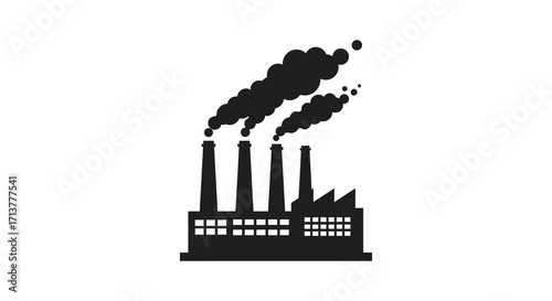 Silhouette of industrial factory emitting dark smoke plumes into the air