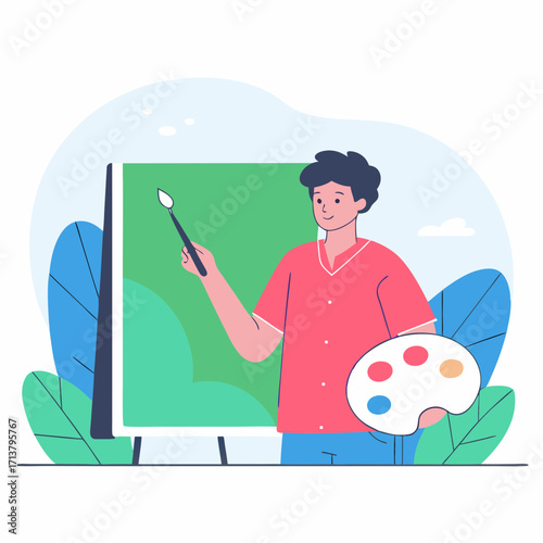 Young man painting on canvas with brush and palette in green setting  