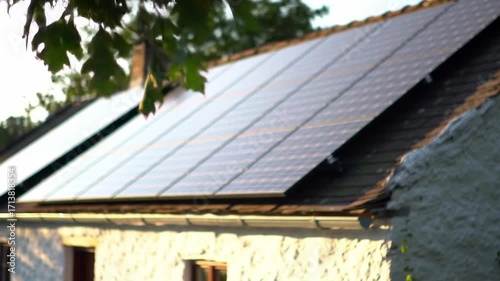 Solar panels on a house roof, blurred background
