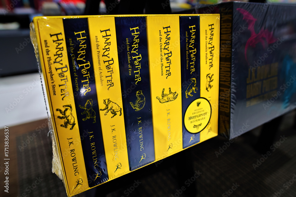 Fototapeta premium Minsk, Belarus. Jan 12, 2025. Collection of Harry Potter novels in english language written by J.K. Rowling displayed on bookstore shelf, fantasy literature series popular with readers, fans. Selectiv