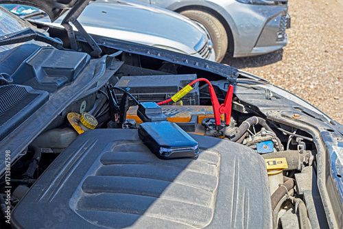 Jumpstart a dead car battery using a power bank in the parking lot
