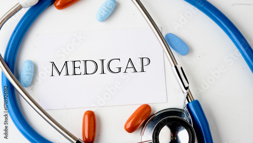 Medical concept. MEDIGAP on the card on a white background. Concept photo