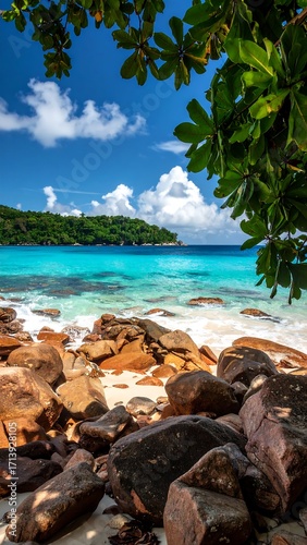 Tropical beach scene with turquoise water and rocks (1)