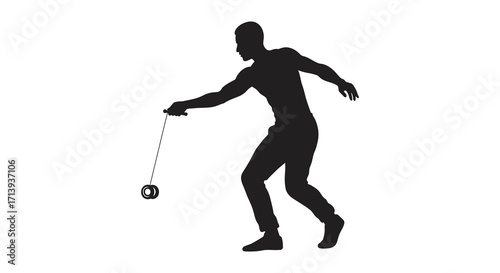 Silhouette of a man playing with a yo yo in motion