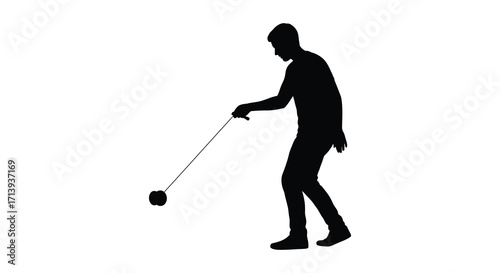 Silhouette of a man skillfully playing with a yo yo outdoors