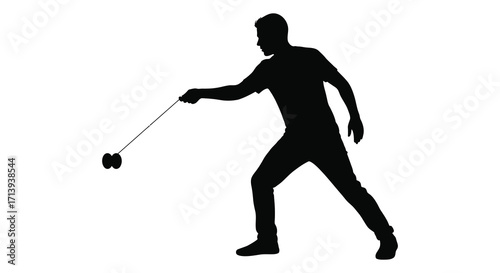 Silhouette of a man skillfully performing tricks with a yo yo