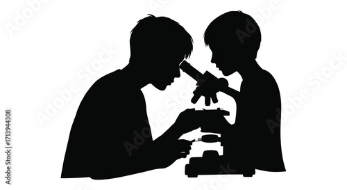 Silhouetted figures of two people examining a sample under a microscope