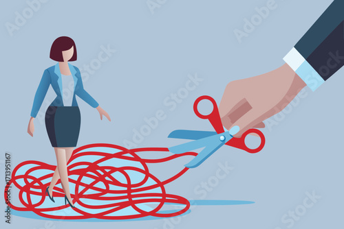 Businesswoman stands amidst tangled red string as a hand cuts it with scissors
