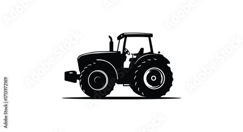 A detailed black silhouette of a modern agricultural tractor on white