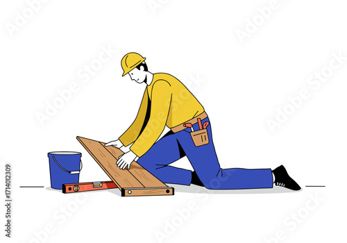Construction worker kneeling while installing wooden floor planks  