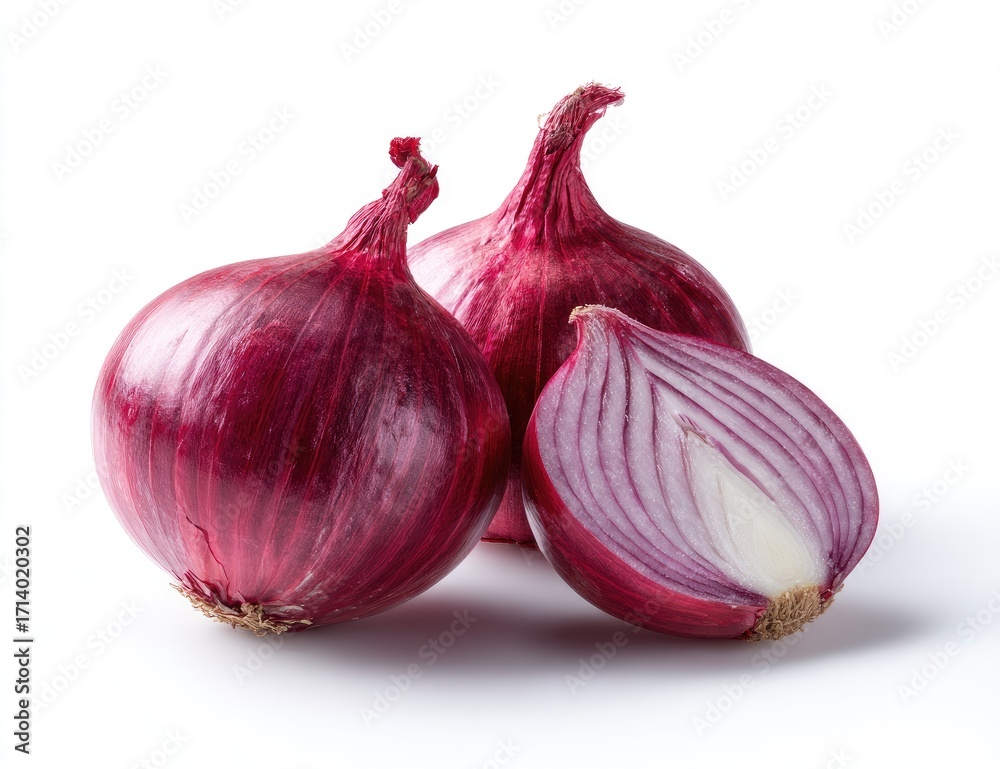 Fototapeta premium Two whole and one sliced red onion on white