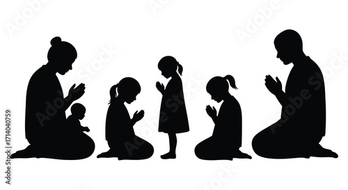 A family of five silhouetted in prayer showing unity and devotion