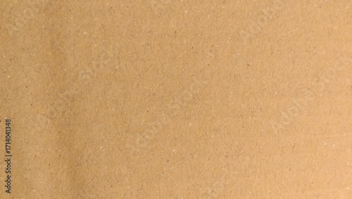 Abstract pattern of beige rough carton, old paper sheet, parchment or papyrus surface, Background of brown kraft paper or cardboard texture. 