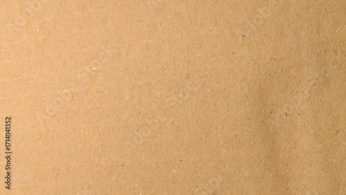 Abstract pattern of beige rough carton, old paper sheet, parchment or papyrus surface, Background of brown kraft paper or cardboard texture. 
