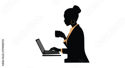 Silhouette of a woman working on a laptop with a coffee cup