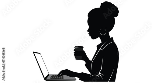 Silhouette of a woman working on a laptop with a coffee cup