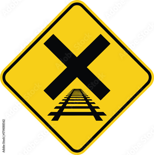 Yellow railroad crossing sign with a black x and tracks