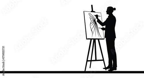Silhouette of an artist painting on a canvas with an easel