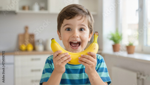 Wallpaper Mural Excited boy with bananas in kitchen Torontodigital.ca