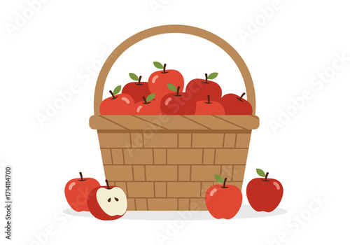 A woven basket overflowing with red apples with more apples scattered around
