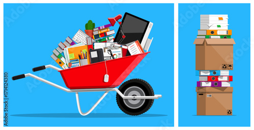 Overloaded wheelbarrow with office supplies and stack of documents in a box. Business move, paperwork concept. Organization of work.