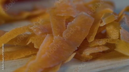 Heap of carrot peels on cutting boatrd