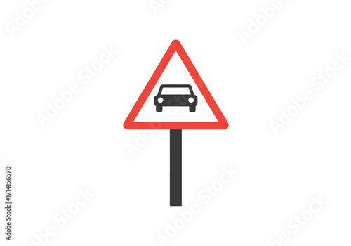 A red triangle warning road sign with a car symbol on a gray post