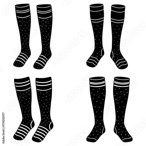 Four pairs of knee high socks in black and white with stripes and dots arranged in a square pattern