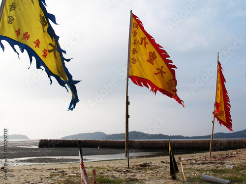 Tablou pe pânză Yantra Prayer flags or vegetarian bunting flag on beach for Thai traveler people