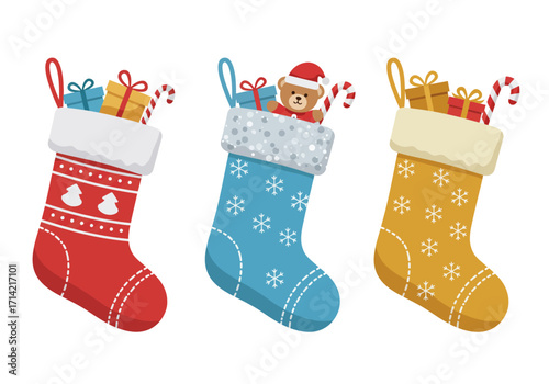 Three Christmas stockings are filled with gifts and candy canes