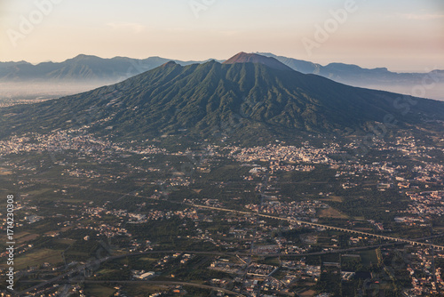 Mount Vesuvius above Naples cityscape, aerial panoramic view, Italy
