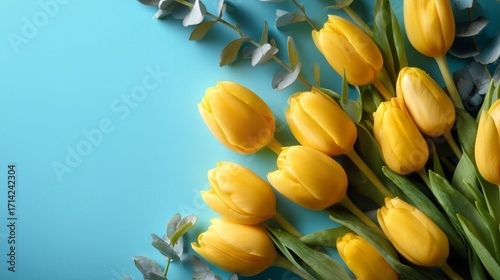Bright Yellow Tulip Bouquet on Aqua Blue Background
