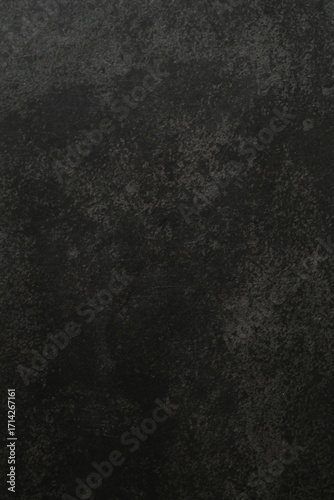 Dark concrete background. Black textured wall 
