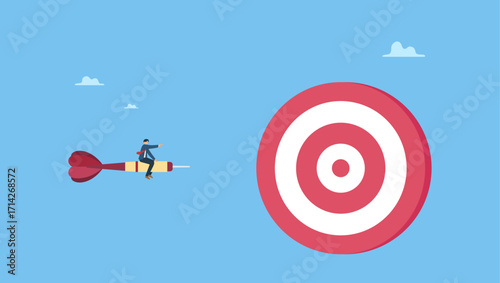 Confidence businessman drives dart straight to the dartboard bullseye. Focus on business goal, reaching target or achievement, achieve business objective or purpose, motivation to success.