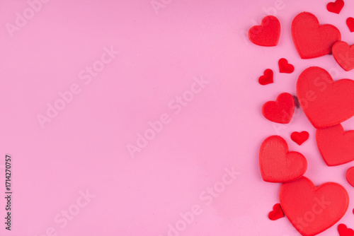 Valentine day pink greeting card background with red hearts