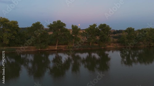 evening above lake , moon rise