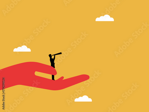Businessman with giant hands looks far ahead